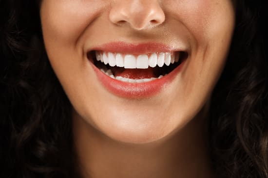 closeup of a woman showing her perfect smile